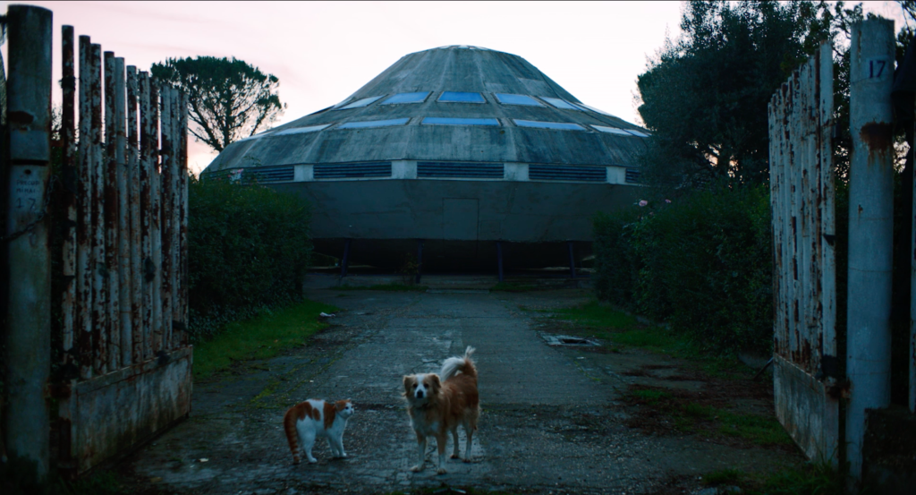 A frame from “ALBE”. This is a real UFO house in Gallicano (in the province of Rome) build in the 70s by a local for his beloved UFO-enthusiastic wife who died of cancer.